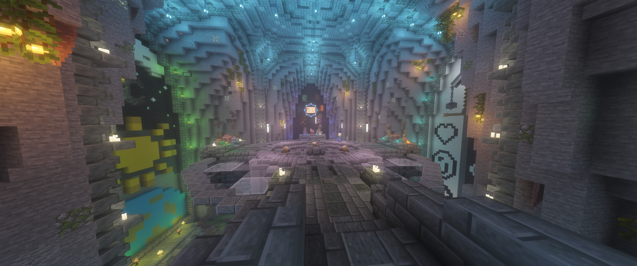 colorfully lit stone building, set recessed into a mountainside, the three walls opposite the viewer contain beautiful murals