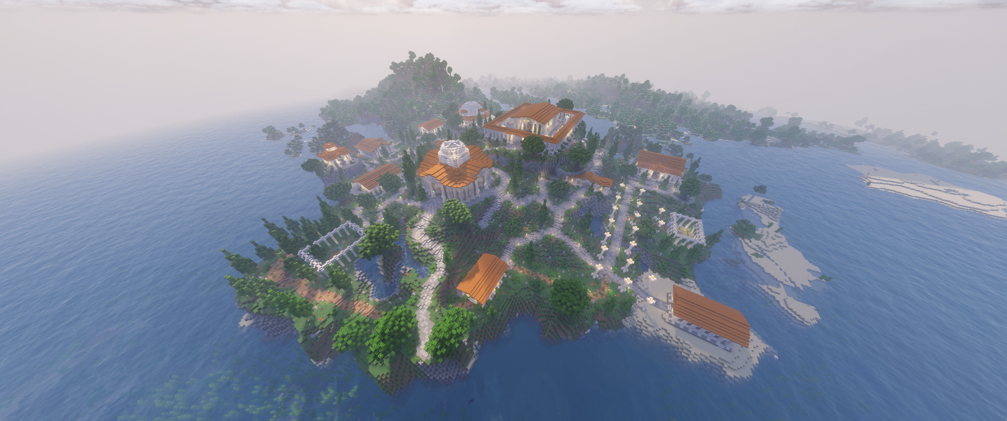 beautiful island covered in grass, trees, and winding gravel paths between various greek-themed temples